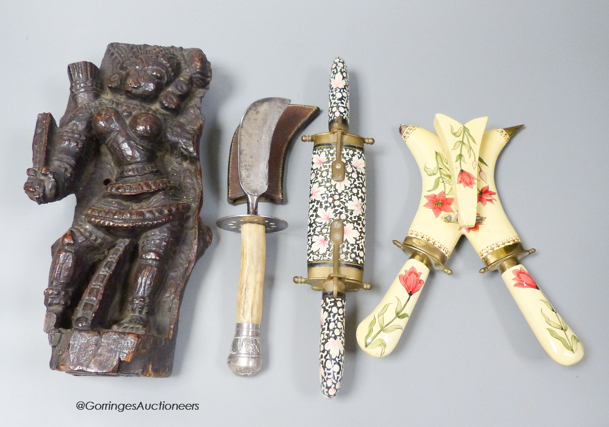 An Indian hardwood figural relief, 18th century or earlier, 28cm, a dagger and two carving knife sets